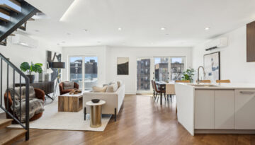 Bright modern open-plan living space for booking a real estate photographer.